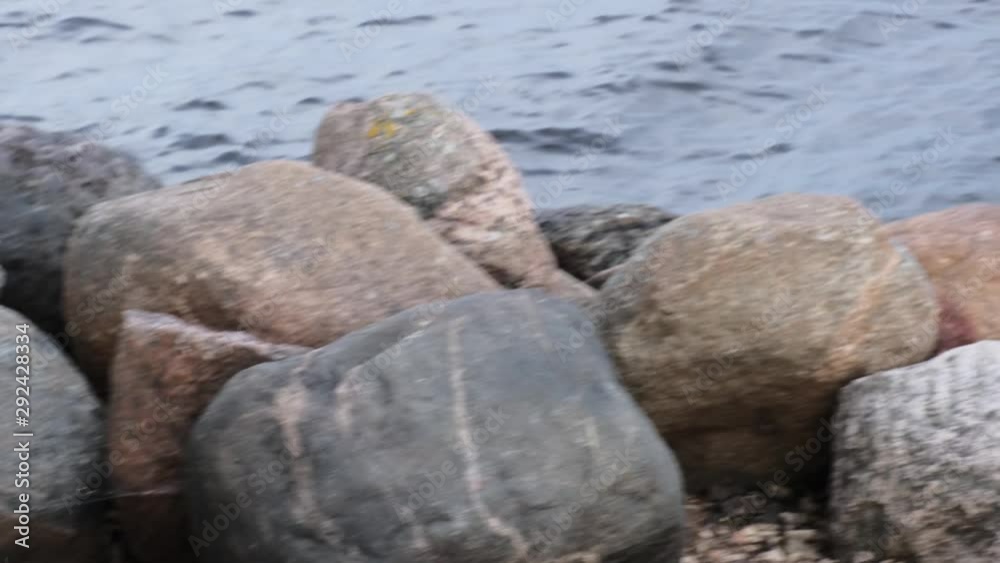 Waves and stones on the seashore in summer. Waves and stones on the seashore in summer.