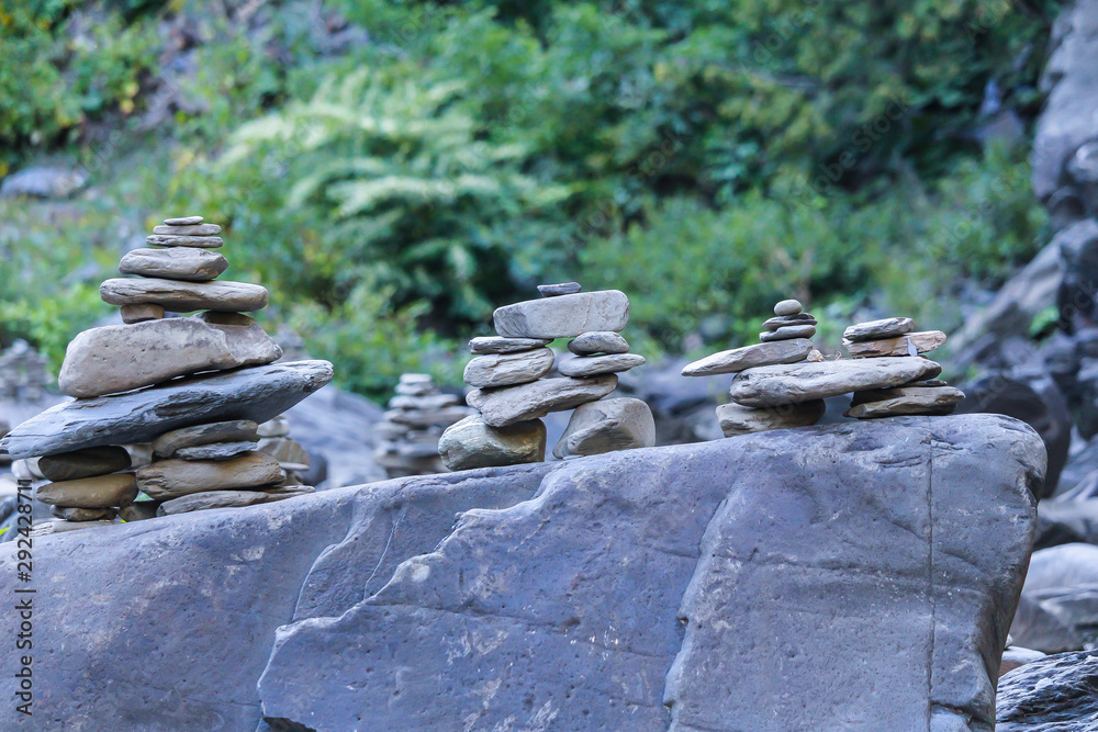 A variety of stones / Inukshuk of Canada beside the creek, Gorge park, Coaticook, Quebec, Canada A variety of stones / Inukshuk of Canada beside the creek, Gorge park, Coaticook, Quebec, Canada