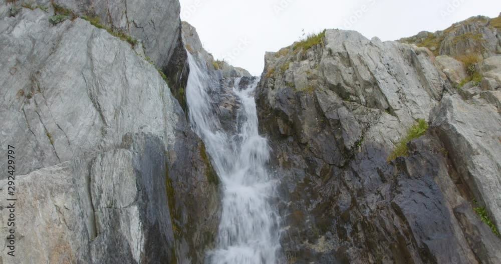Waterfall in the Swiss Alps near Rhone Glacier. Switzerland Waterfall in the Swiss Alps near Rhone Glacier. Switzerland