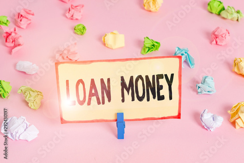 Conceptual hand writing showing Loan Money. Concept meaning Something lent or furnished on condition being returned Colored crumpled papers empty reminder pink floor clothespin