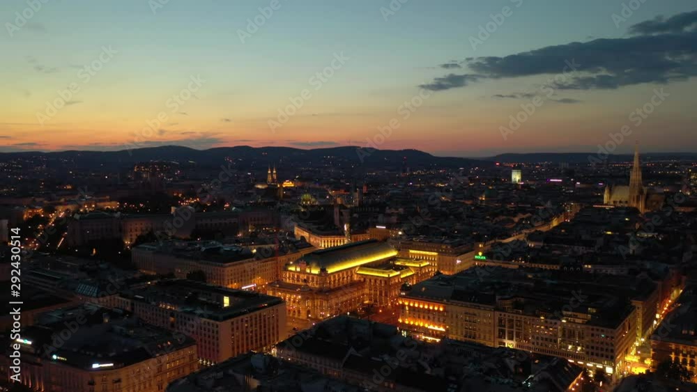 night sunset illumination flight over vienna city opera house district aerial panorama 4k austria