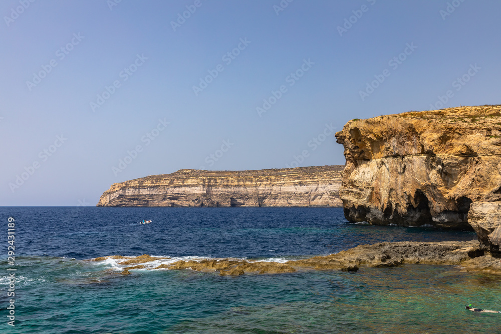 Stunning view at the coast of Dwejra Bay with the ruin of Azure Window on Gozo island in Malta