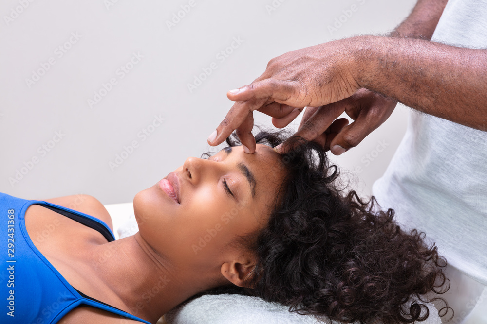Fototapeta premium Woman Having Reiki Healing Treatment