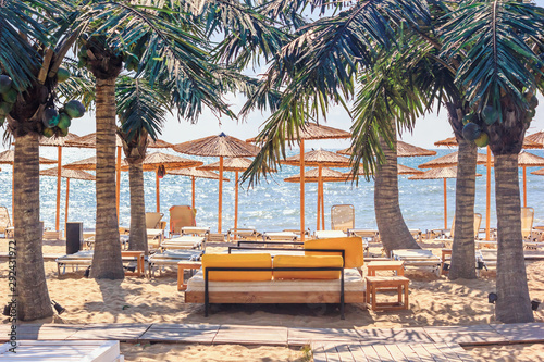 Coastal landscape - view of the beach umbrellas and loungers, city of Varna, on the Black Sea coast of Bulgaria