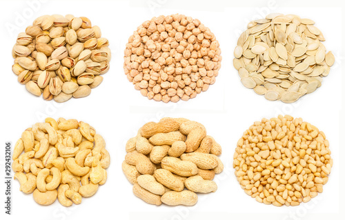 Set of nuts - pistachio nuts in the shell, chickpea seeds without shell, pumpkin seeds in the shell, raw cashew seeds without shell, peanut in the shell, pine nut kernels, isolated on white background