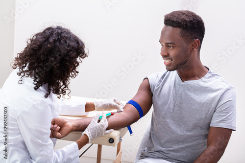 Obraz na plátne Doctor Taking Blood Sample