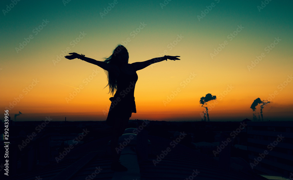 Sunset Girl on the roofs of cologne in germany - freedom