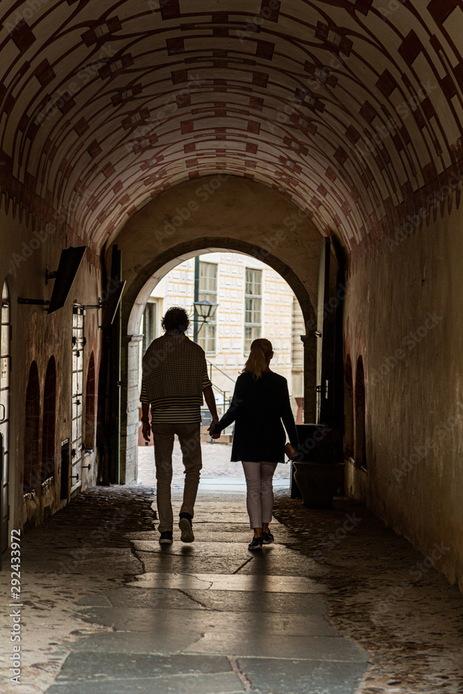 A couple who are going through an archway