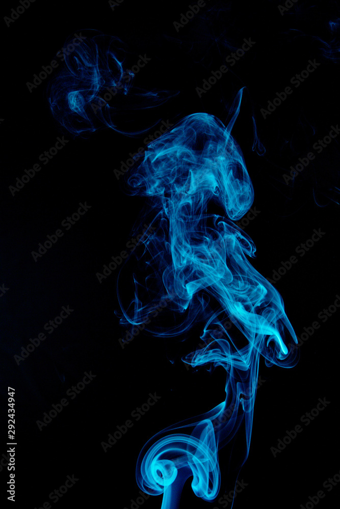Fototapeta premium Blue abstract smoke on black background
