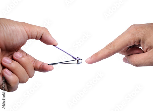 The human hand is cutting the nail apart from the white background