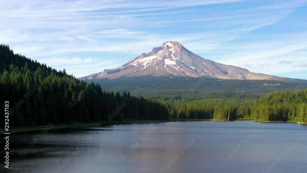 Descending aerial shot of Mt. Hood over Trillium lake in Oregon at sunrise Descending aerial shot of Mt. Hood over Trillium lake in Oregon at sunrise