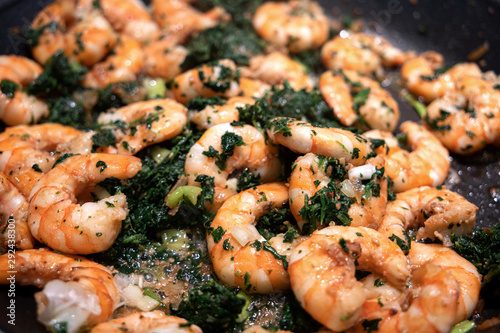 Картината върху платно gourmet pan fried sauteed fresh American gulf shrimp with bacon and spinach in a