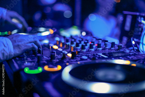 DJs hand on mixer
