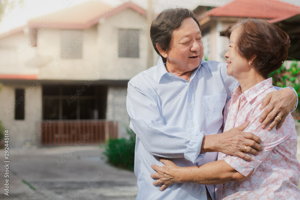 Fototapeta premium Happy elderly couple with lifestyle after retiree concept. Lovely asian seniors couple embracing together .