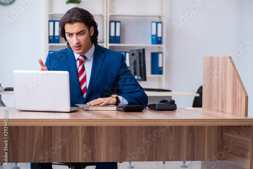 Young male businessman working in the office