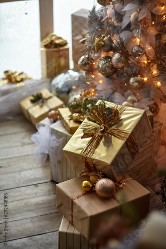 Beautiful New Year gift on a background of lights garlands.