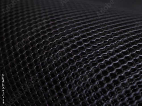 abstract background from black plastic mesh