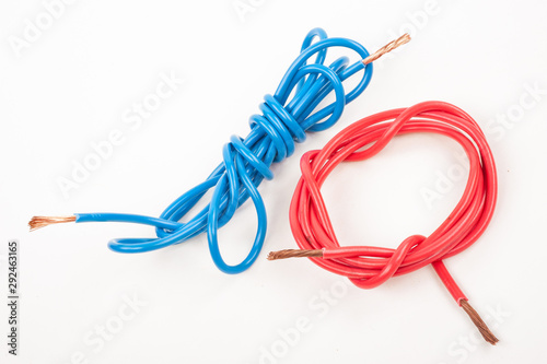 Blue and red electric wire on white background