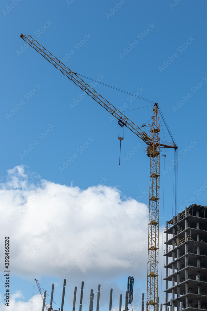 building under construction. construction cranes at a construction site