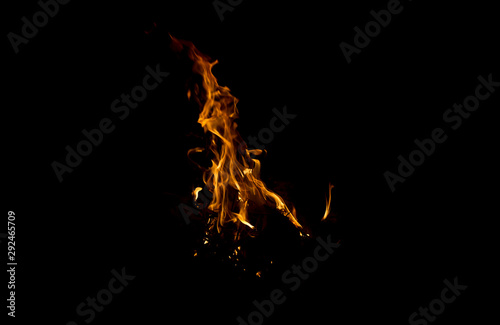 Fire burning at night, black background