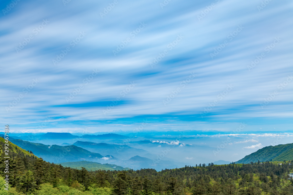 Mountains and sea of clouds under blue sky and white clouds, mount emei, sichuan province, China