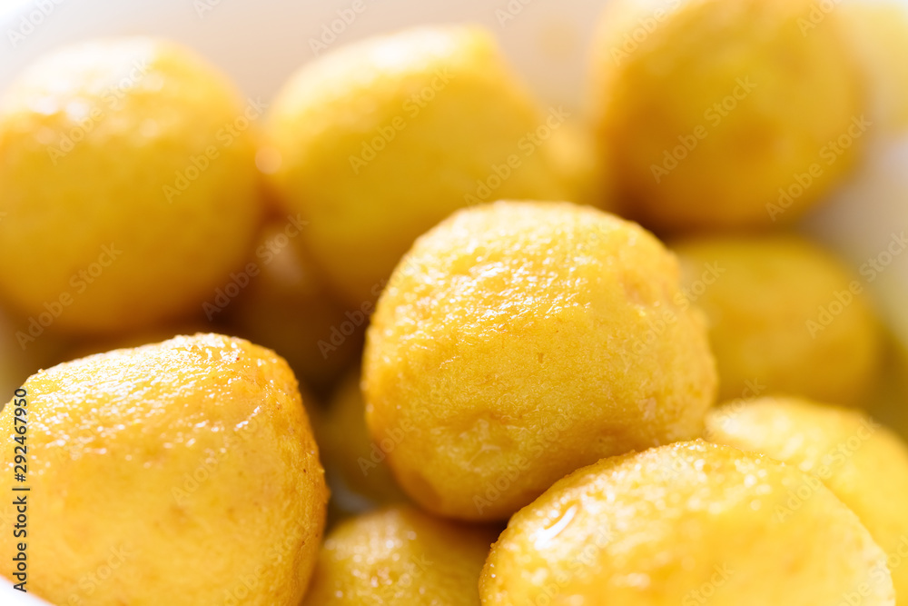 side view curry flavor fish balls in bowl side view curry flavor fish balls in bowl