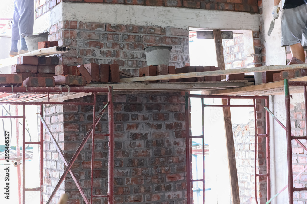 Naklejka premium plasterers making up brick walls