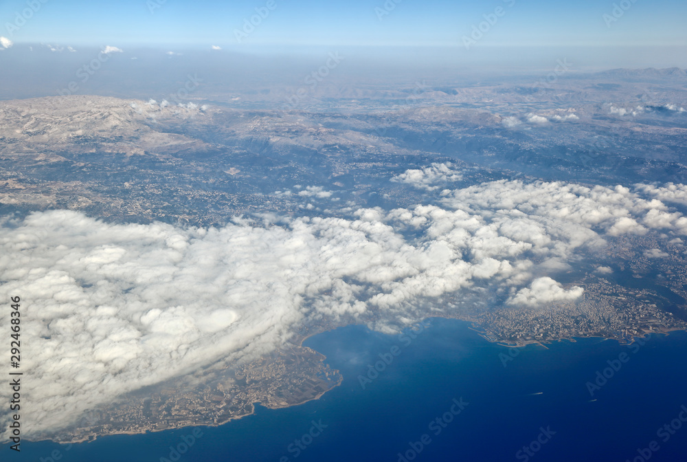 Aerial View of Lebanon, mountains, clouds and the mediterranean sea with the Bay of Jounieh.