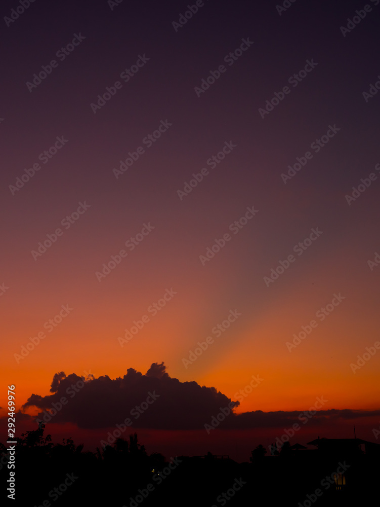 Fiery sunset landscape with darkness foreground in siem reap city in Cambodia during rainy season Fiery sunset landscape with darkness foreground in siem reap city in Cambodia during rainy season
