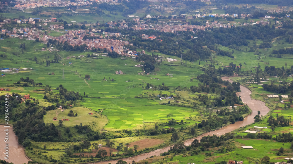 Aerial view of a river flowing through fields