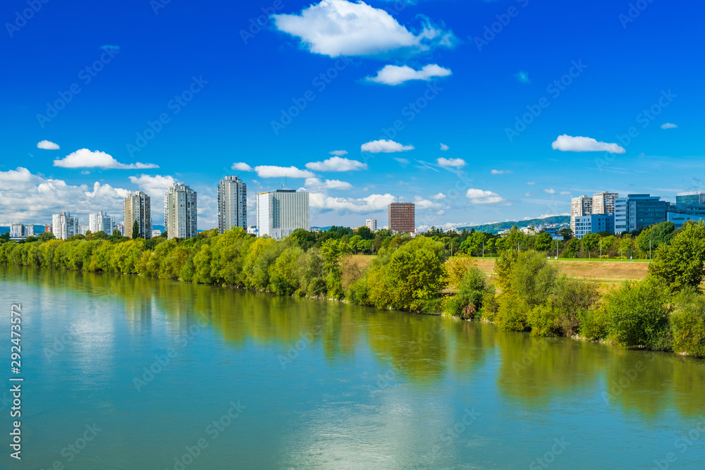 Croatia, city of Zagreb, surface of the Sava river and modern towers skyline in autumn day