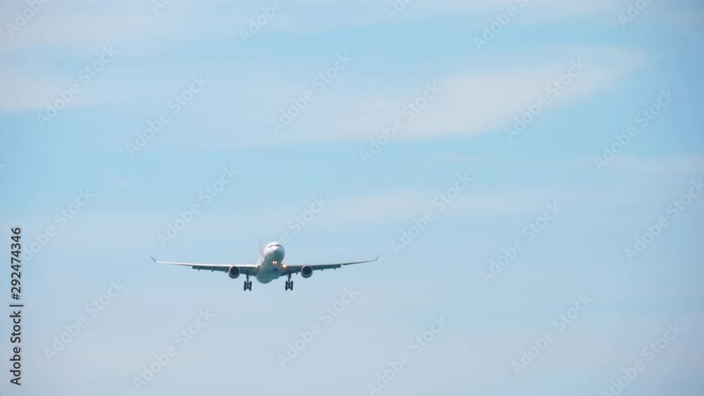 Widebody airplane approaching over ocean Widebody airplane approaching over ocean