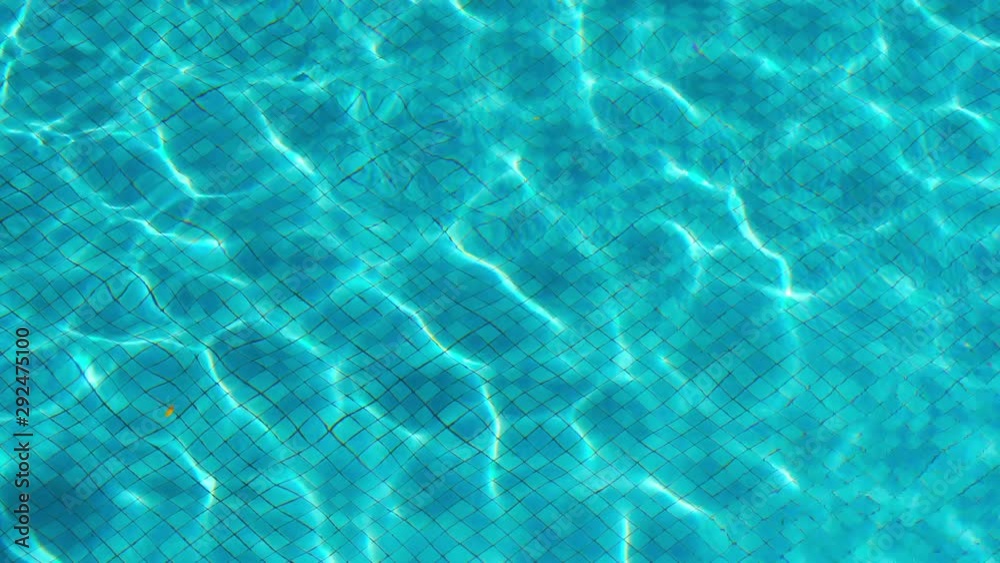 Flowing abstract reflected sunlight from the rippled surface of the water in a tranquil pool. Flowing abstract reflected sunlight from the rippled surface of the water in a tranquil pool.