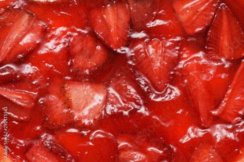 Fragment of a strawberry pie filling. Strawberry jam and pieces of berries. Top view photo