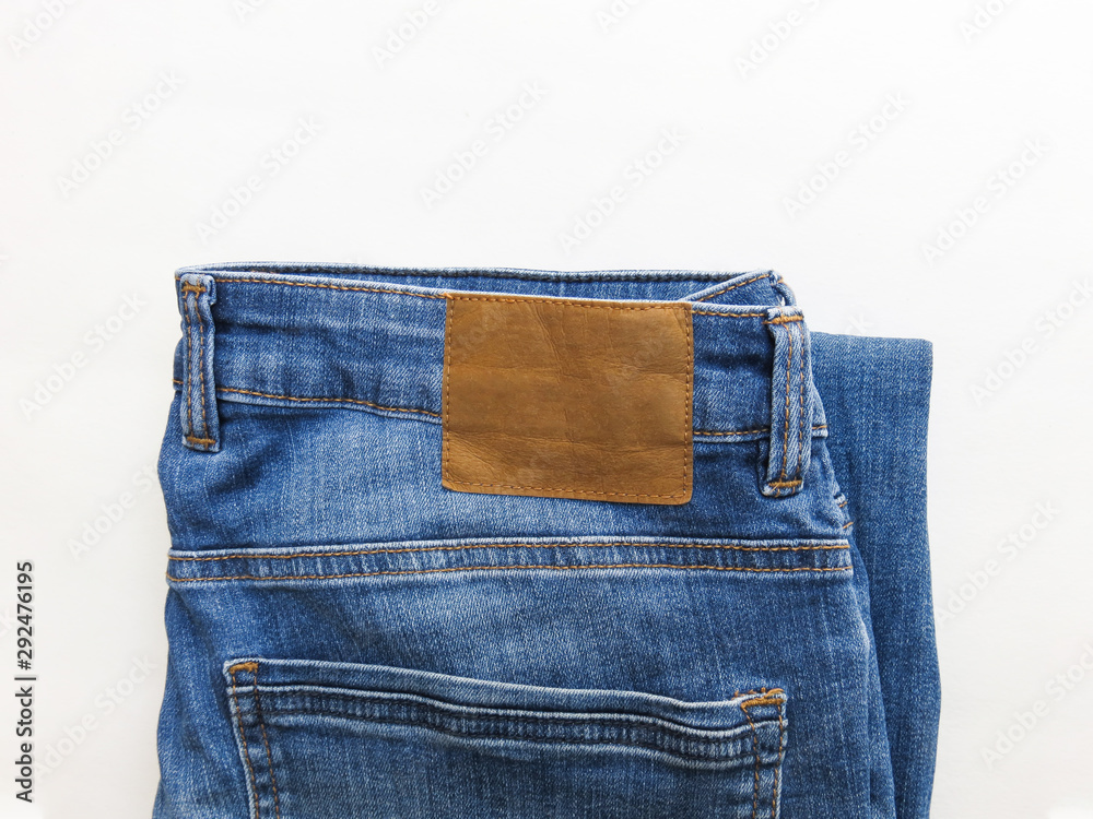 Blank leather Jeans Label sewed on a Blue Jeans. Mock up. High Resolution.
