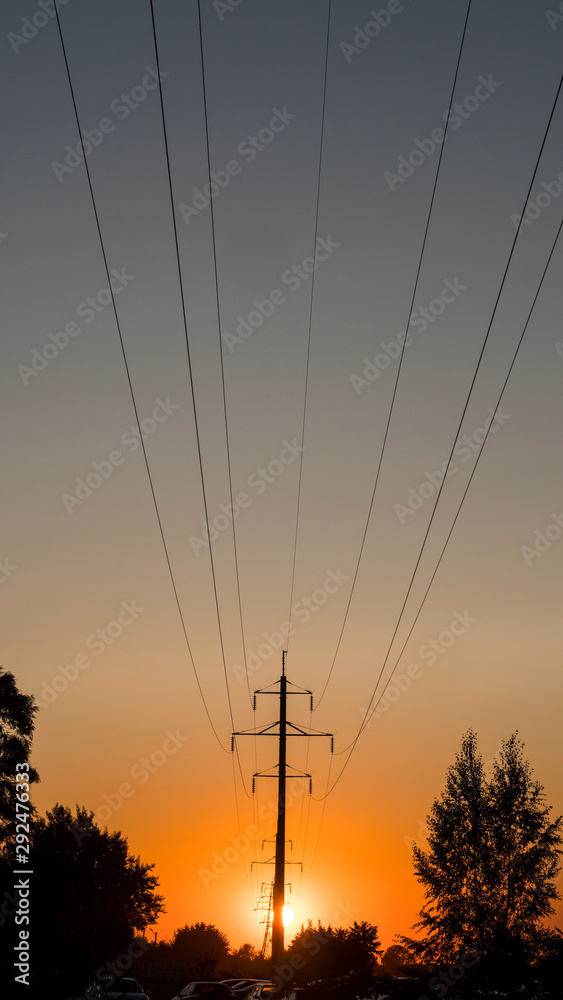 Power line wires reach for a high post. Power transmission