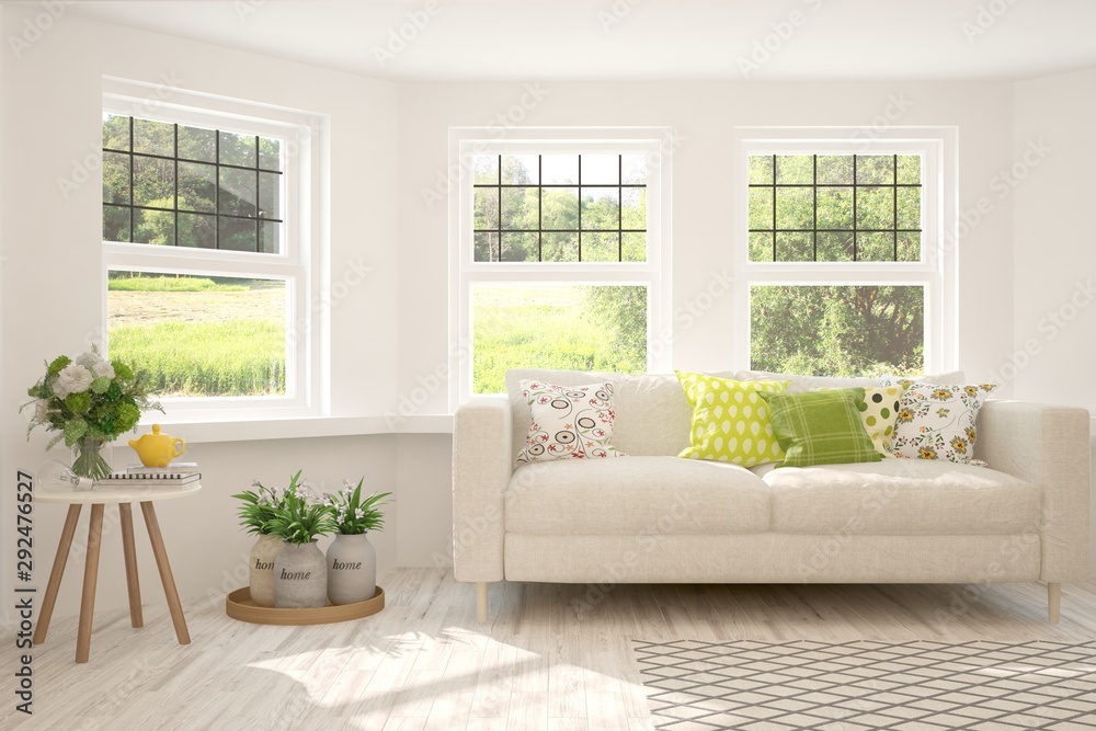 Stylish room in white color with sofa and summer landscape in window. Scandinavian interior design. 3D illustration Stylish room in white color with sofa and summer landscape in window. Scandinavian interior design. 3D illustration