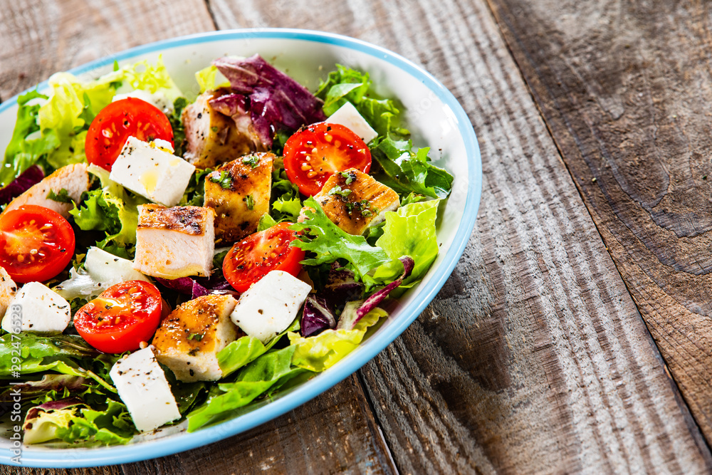 Caesar salad on wooden table Caesar salad on wooden table