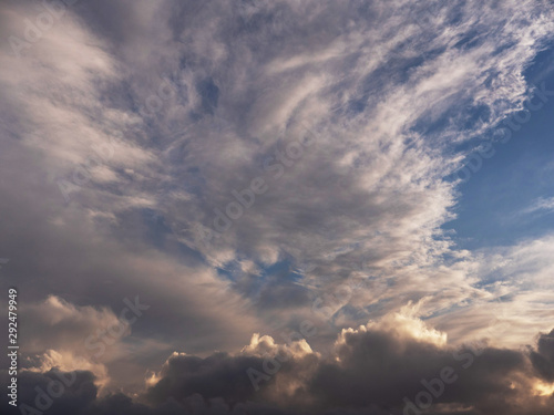 Dramatic clouds on bright blue sky. © mark_gusev