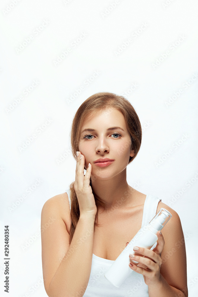 Beauty and Spa Concept. Beautiful Young Woman with Clean Fresh Skin touch face. Facial treatment. Girl Female With Natural Makeup.Cosmetology. Skin Care Beauty and Spa Concept. Beautiful Young Woman with Clean Fresh Skin touch face. Facial treatment. Girl Female With Natural Makeup.Cosmetology. Skin Care