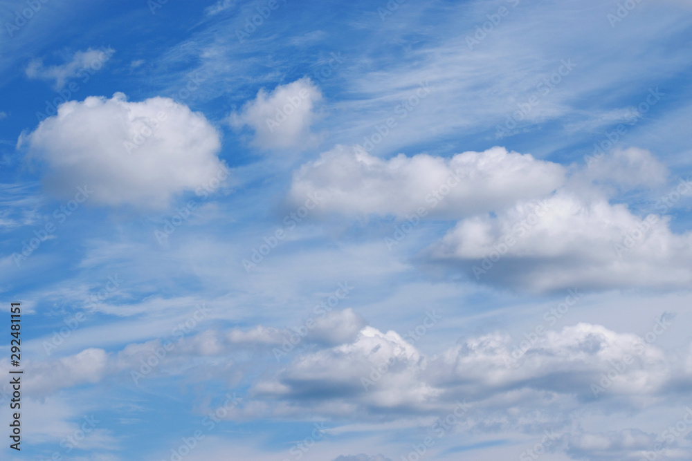 Beautiful white clouds in the blue sky. Picturesque cloudscape background Beautiful white clouds in the blue sky. Picturesque cloudscape background