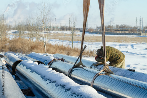 Installation and welding works on main gas pipeline route in winter photo