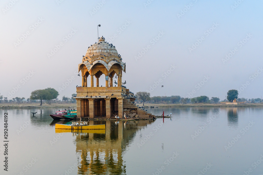 Fototapeta premium Gadisar lake in the morning at sunrise. Man-made water reservoir with temples in Jaisalmer. India