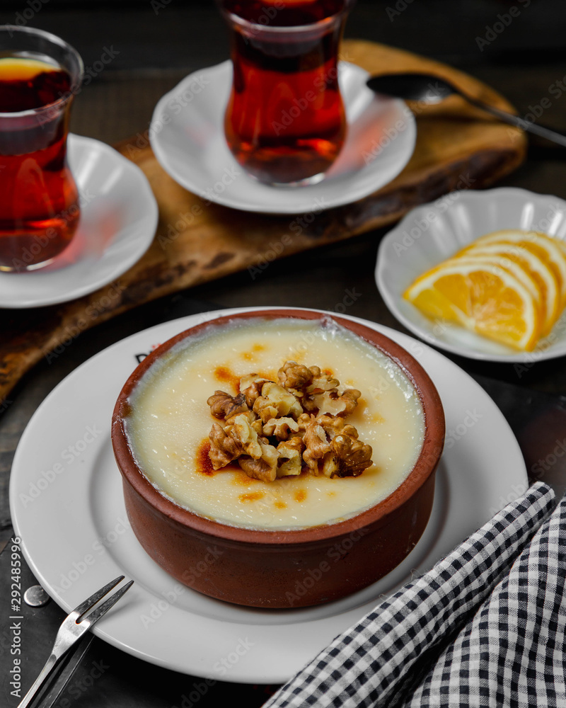 Turkish dessert kazandibi topped with walnuts Turkish dessert kazandibi topped with walnuts