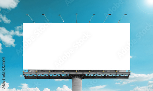 Mockup Large white blank billboard or white promotion poster displayed on the outdoor against the blue sky background. Promotion information for marketing announcements and details photo
