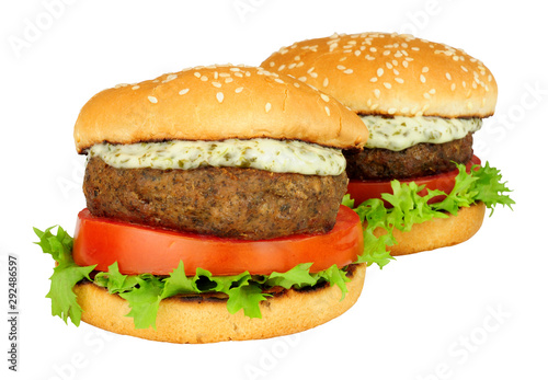 Lamb burger sandwiches with fresh salad and mint yoghurt sauce isolated on a white background