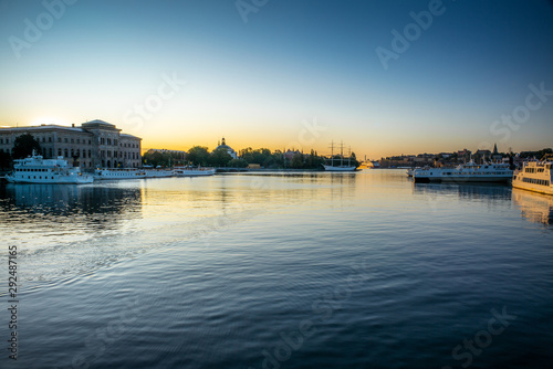 View of the Swedish National Museum building reflecting in the sea water early in the morning in autumn © gdefilip