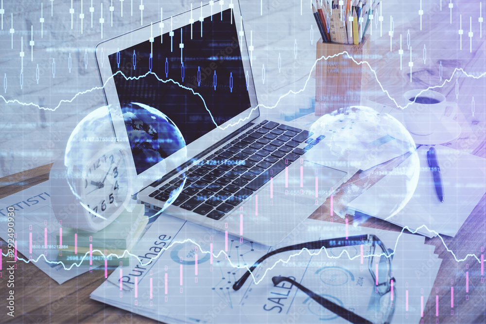 Financial market graph hologram and personal computer on background. Double exposure. Concept of forex. Financial market graph hologram and personal computer on background. Double exposure. Concept of forex.