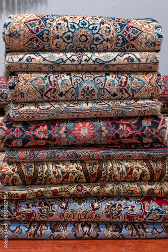 Traditional carpets for sell at a street market stall in Turkey