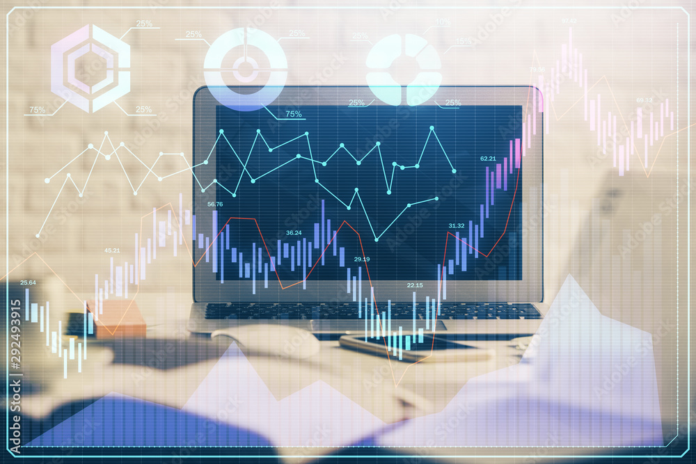 Financial chart drawing and table with computer on background. Double exposure. Concept of international markets. Financial chart drawing and table with computer on background. Double exposure. Concept of international markets.